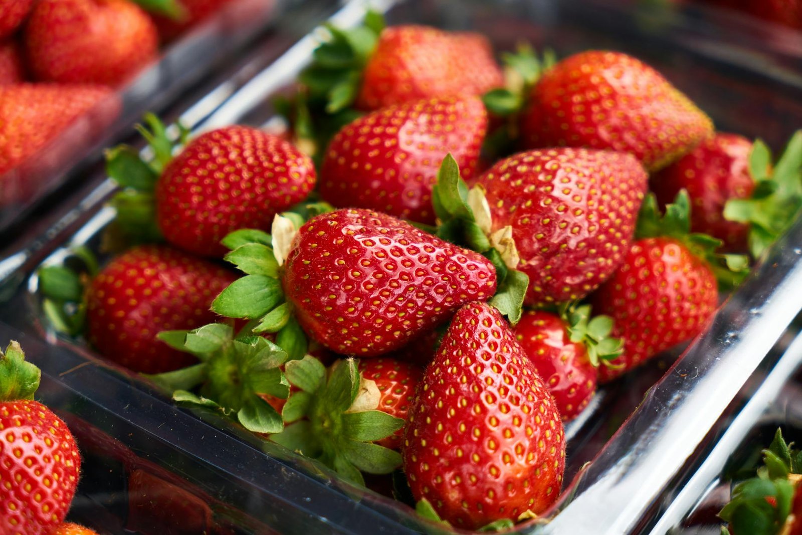 selective focus photography of strawberries